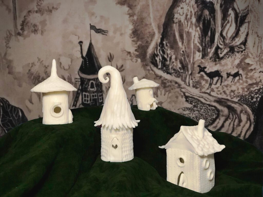White little houses made of modelling clay.